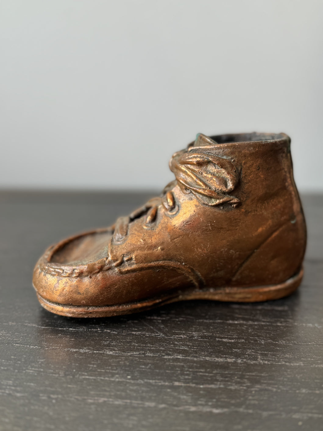 copper baby shoe